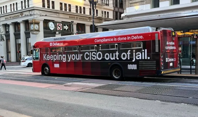 A framed security certificate on a wall with a visible crack running through it, representing the gap between compliance and real security